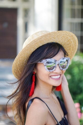 boat hat, cat eye glasses, marble sunglasses, red tassel earrings, liberti us