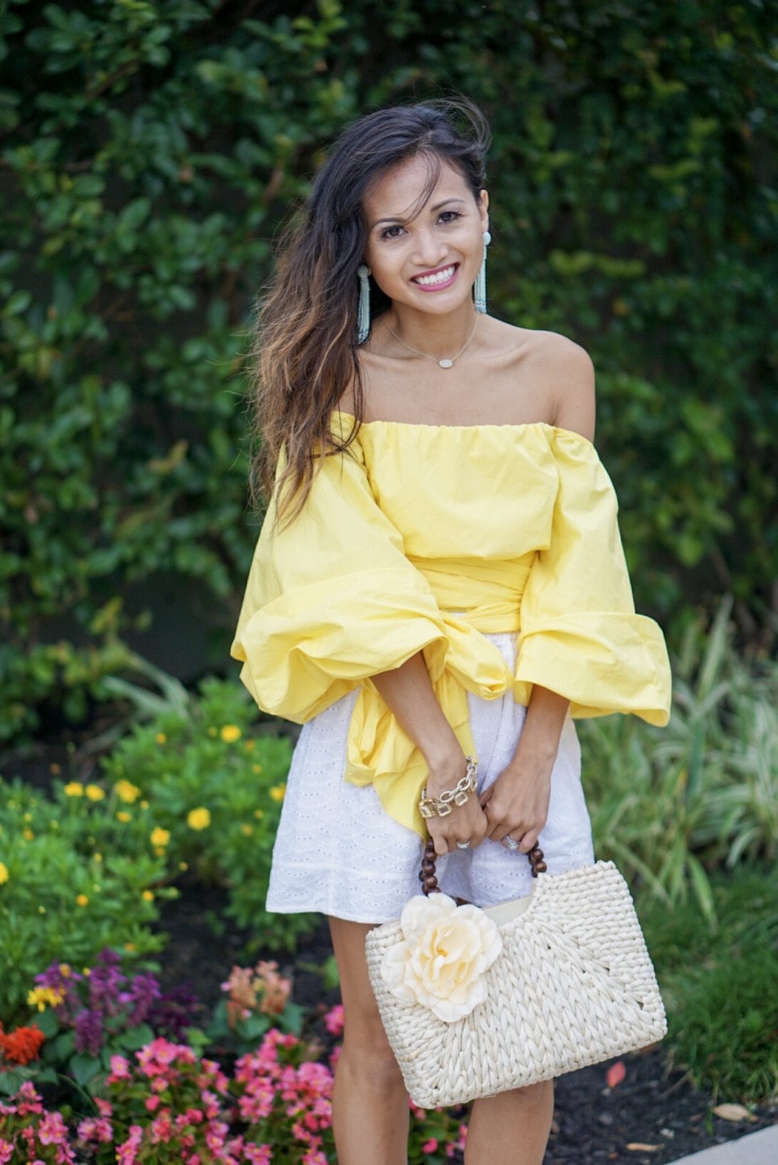 yellow top, bow blouse, blush and stone boutique, floral straw bag, tassel earrings