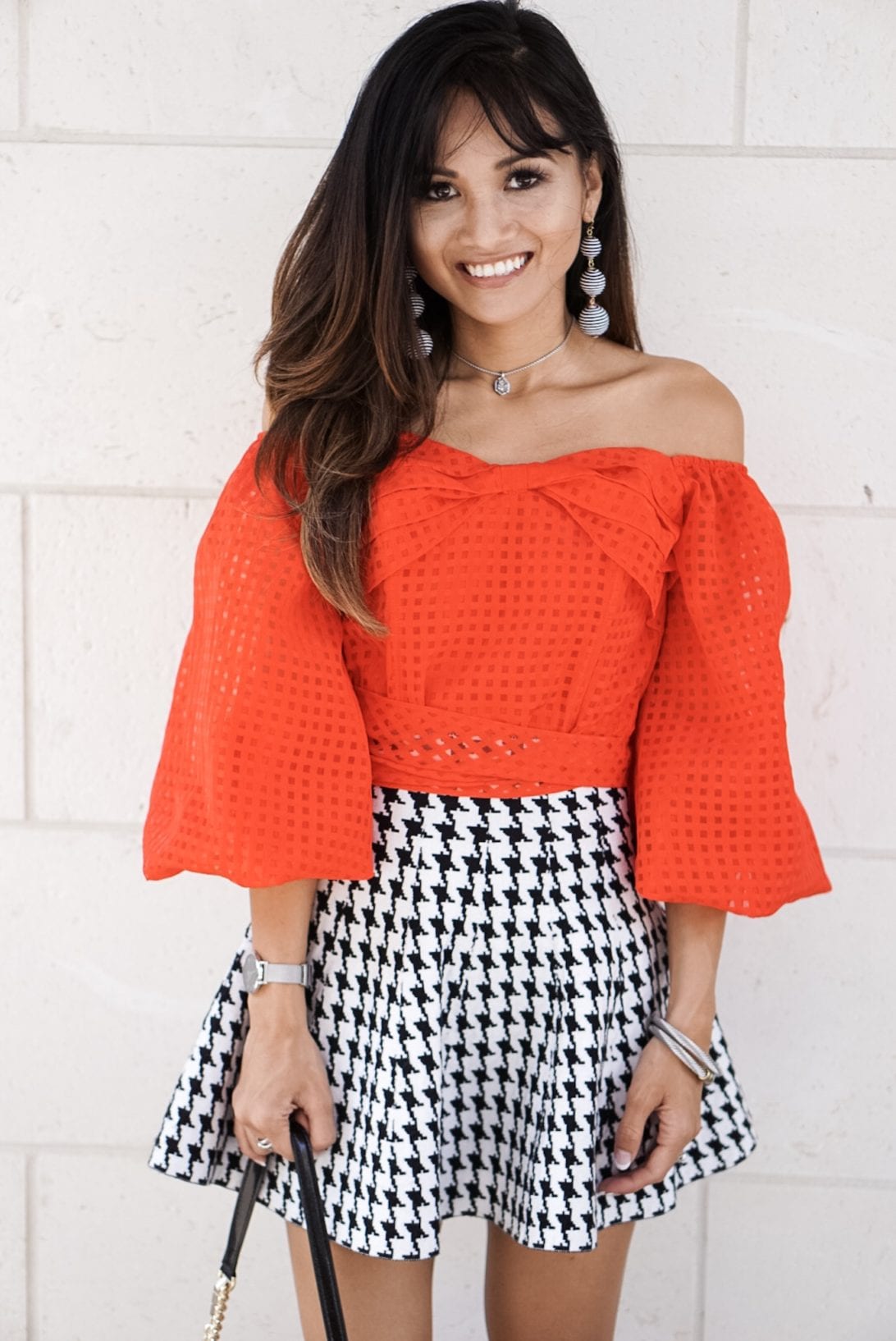 houndstooth skirt, mini skirt, red off the shoulder top, drop ball earrings