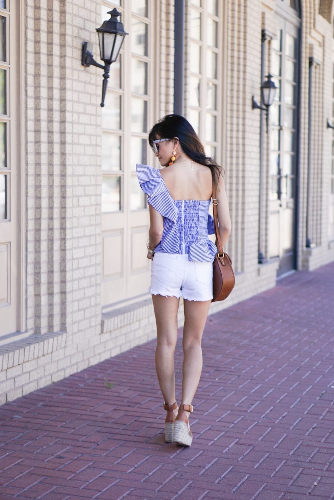 ONE-SHOULDER GINGHAM RUFFLE BLO-- USE, white shorts, marc fisher wedges, quay sunglasses, charming charlie, austin earring