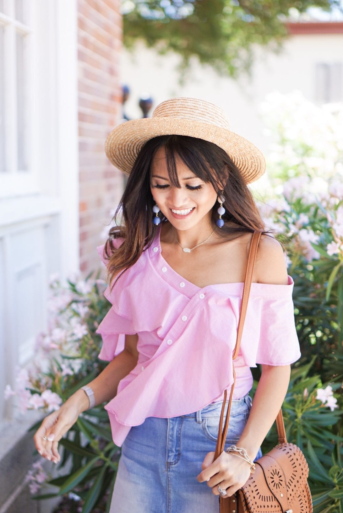 off the shoulder top, bauble ball earring, asymmetrical top, whip stitch cross body bag, boat hat, denim skirt, summer look, how to style a denim skirt, 