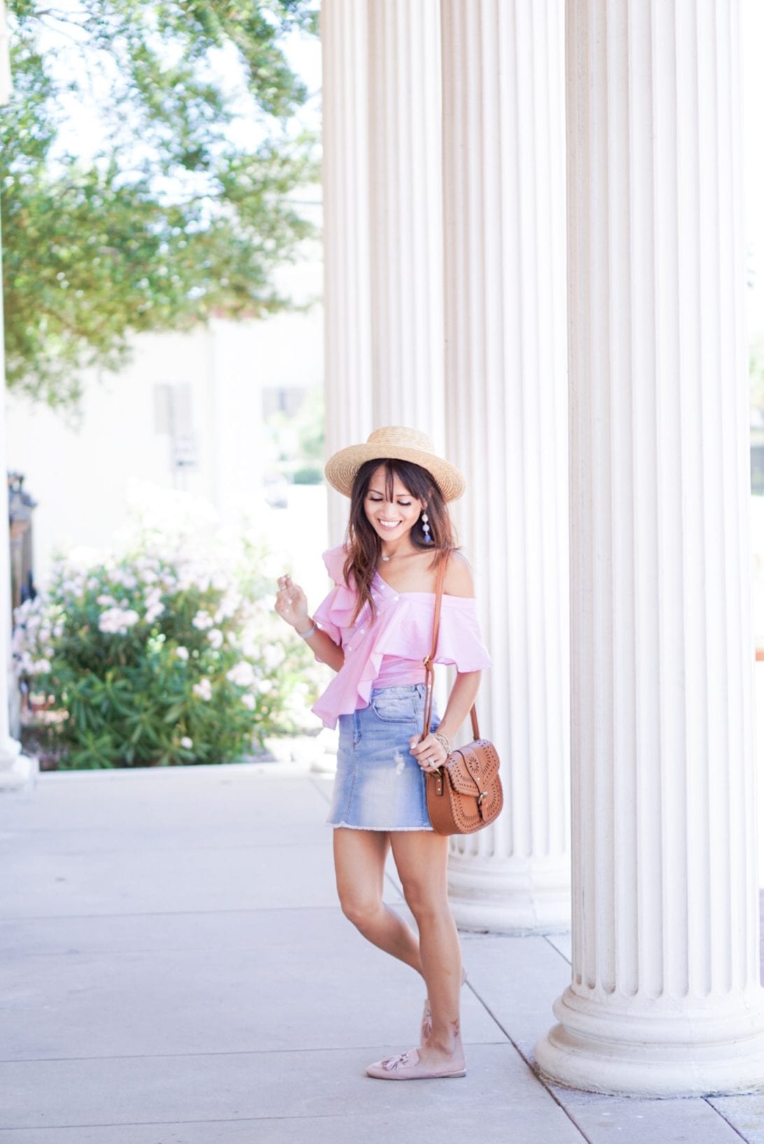 off the shoulder top, bauble ball earring, asymmetrical top, whip stitch cross body bag, boat hat, denim skirt, summer look, how to style a denim skirt, tassel flats, tassel mules, pink slip ons, pink tassel mules, summer style