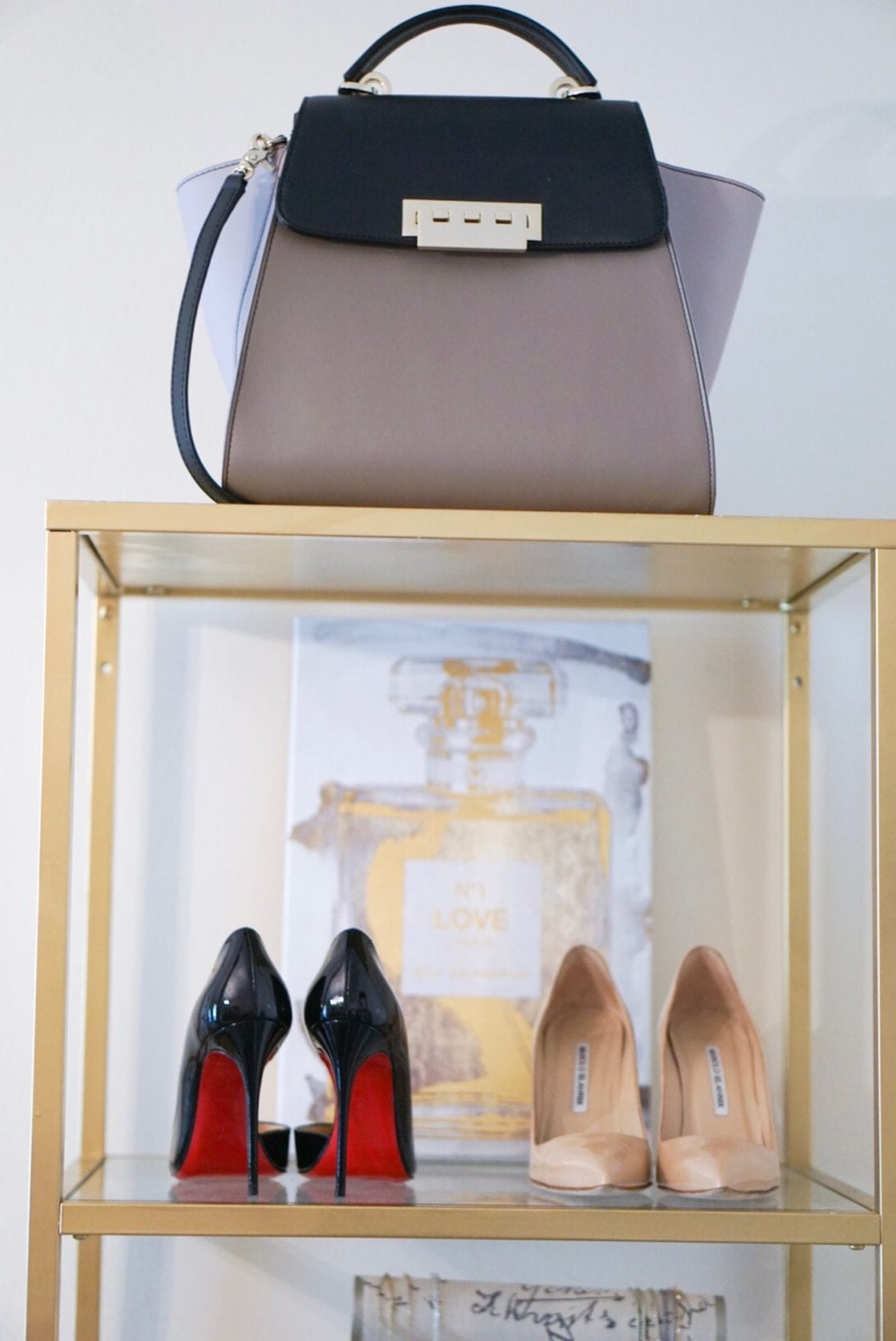 ZAC zac posen bag, christian louboutin shoes, manolo blanik, chanel, wall art, office, shoe display