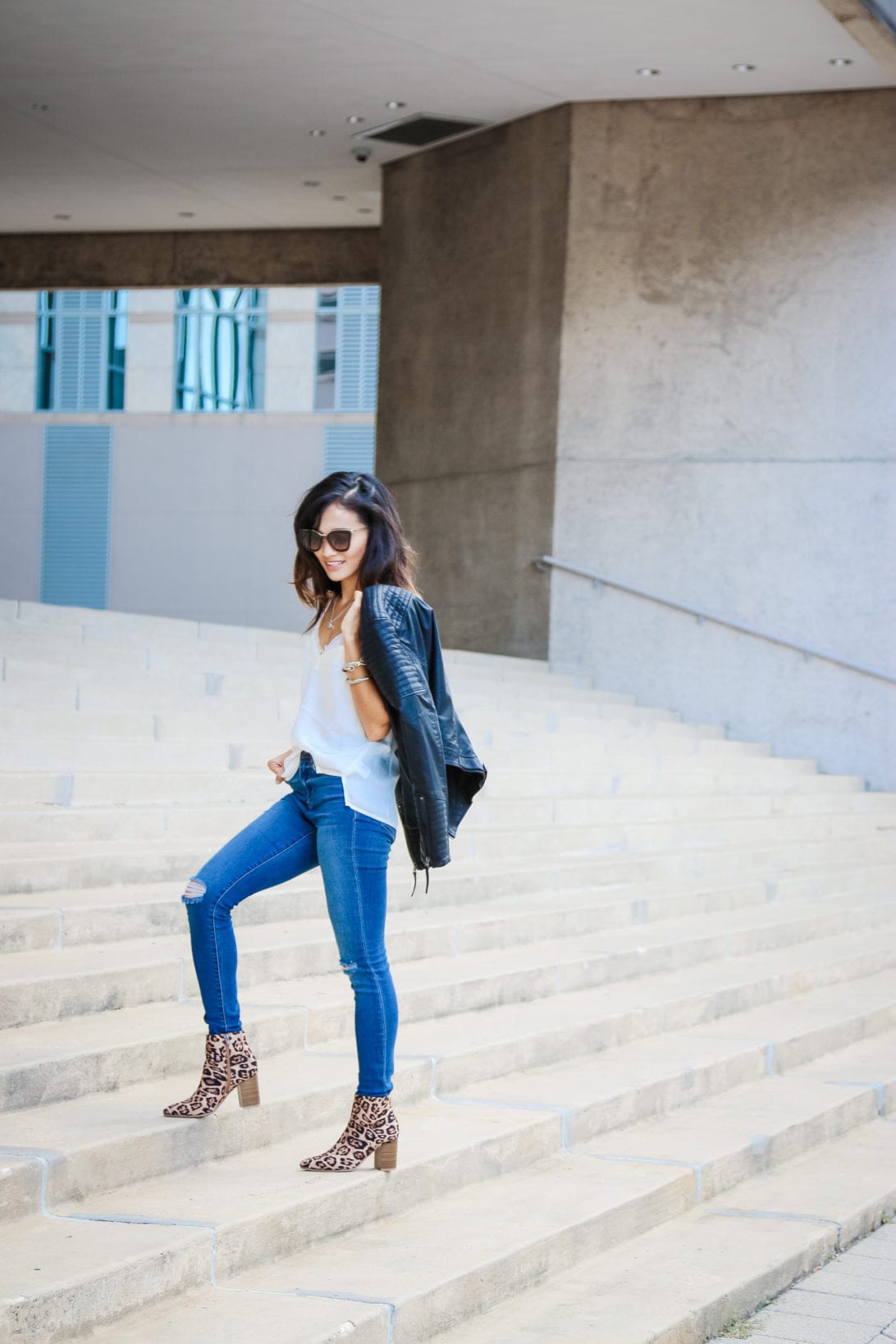 what to wear after Labor Day, Labor Day outfit, leather moto jacket, black leather jacket, moto jacket, ripped jeans, leopard booties, Prada sunglasses, statement booties, fall outfit