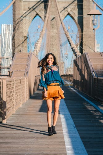 NYFW, NYFW OUTFIT, NYFW STREETSTYLE, New York FASHION WEEK, NYFW 2017, BROOKLYN BRIDGE, BROOKLYN BRIDGE PHOTO SHOOT, AGACI, SATIN SKIRT, RUFFLE TOP, BLACK STUDDED BOOTIES. SCARF, TIE SCARF, CAMERA BAG