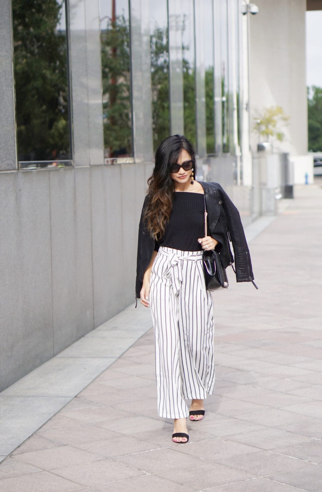 work wear outfit, business causal outfit, striped pants, culottes, wide leg pants, striped wide leg pants, Versace sunglasses, leather Moto jacket, love crossbody bag, Rebecca minkoff, black block heels, how to wear wide leg pants, outfit idea, outfit inspiration 