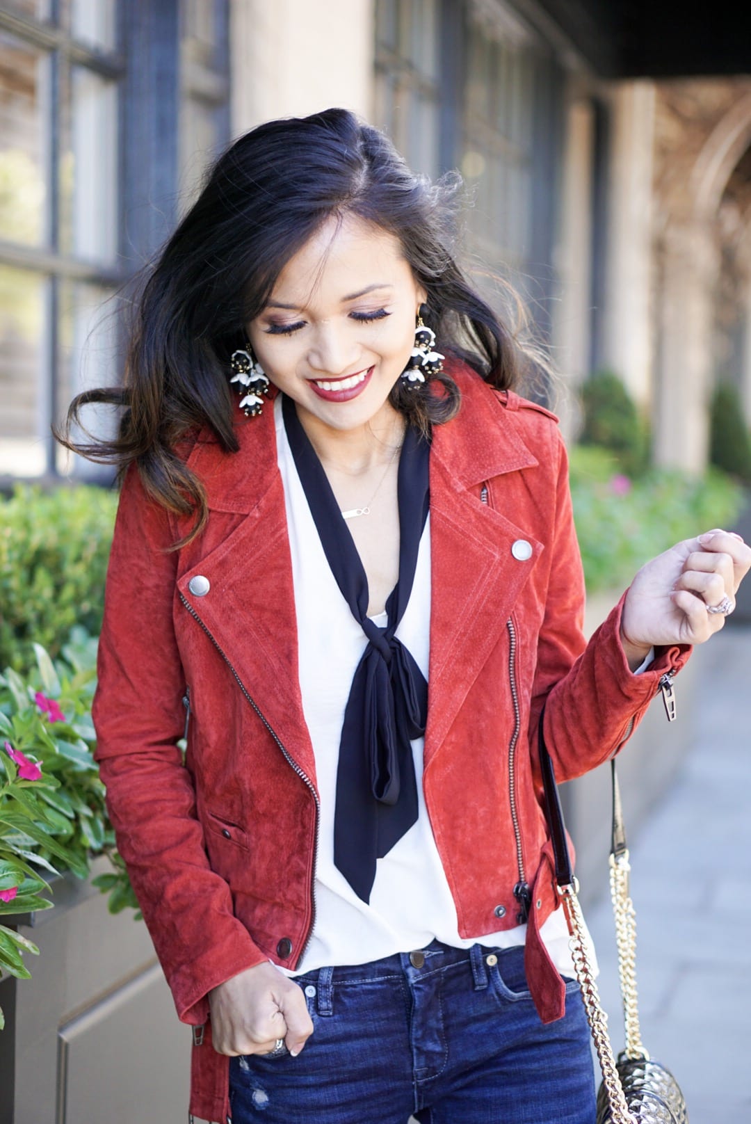 ZAPPOS, blank NYC, blank NYC denim, BLANK NYC MOTO JACKET, SUEDE JACKET, RED JACKET, HOLIDAY OUTFIT, CHRISTMAS OUTFIT, URBANATTITUDE, BAUBLE BAR STATEMENT EARRINGS, REBECCA MINKOFF CROSSBODY BAG, RED BOTTOMS, CHRISTIAN LOUBOUTIN HEELS, BLACK HEELS , TIE FRONT TOP 