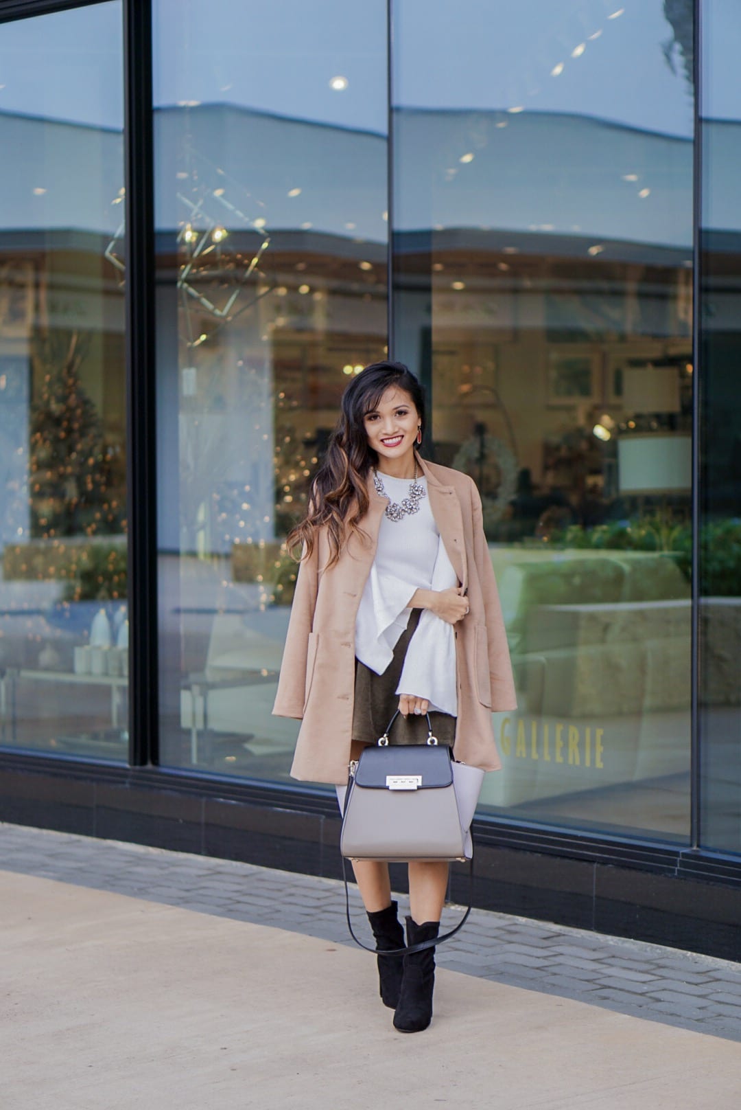 camel coat, corduroy skirt, black sock booties, winter outfit, white bell sleeve top, Zac Posen bag, red Kendra Scott earrings