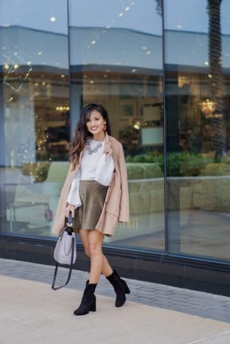 camel coat, corduroy skirt, black sock booties, winter outfit, white bell sleeve top