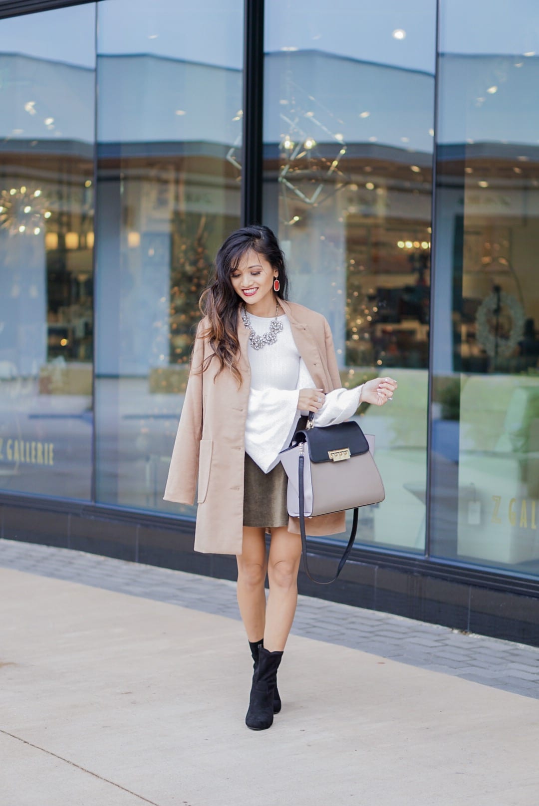 camel coat, corduroy skirt, black sock booties, winter outfit, white bell sleeve top, Zac Posen bag, red Kendra Scott earrings