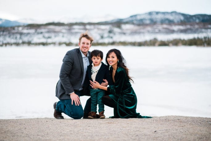 family pictures, snow family pictures, Colorado family pictures, frozen lake, christmas card family pictures, boy mom, green velvet dress, velvet dress, engagement pictures, couples pictures