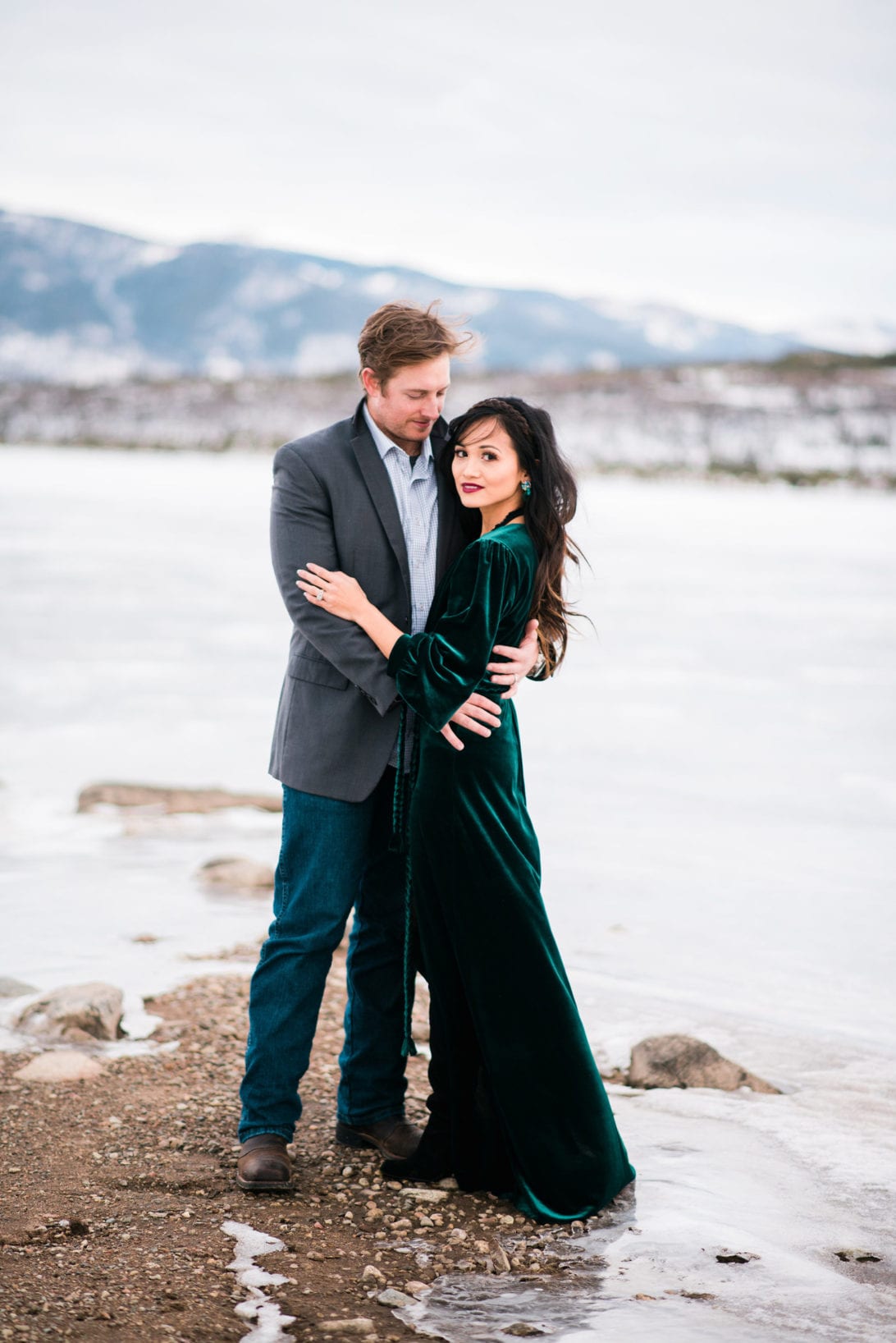 family pictures, snow family pictures, Colorado family pictures, frozen lake, christmas card family pictures, boy mom, green velvet dress, velvet dress, engagement pictures, couples pictures