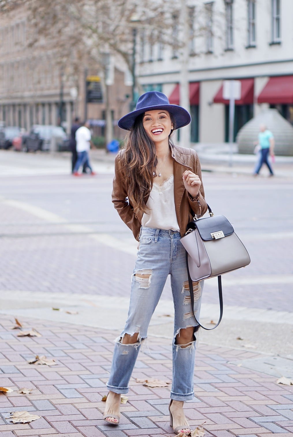 leather jacket, brown leather jacket, moto leather jacket, mom jeans, distressed jeans, navy felt hat, Steve Madden Carson sandal, white lace cami, Zac Zac Posen bag, spring outfit 