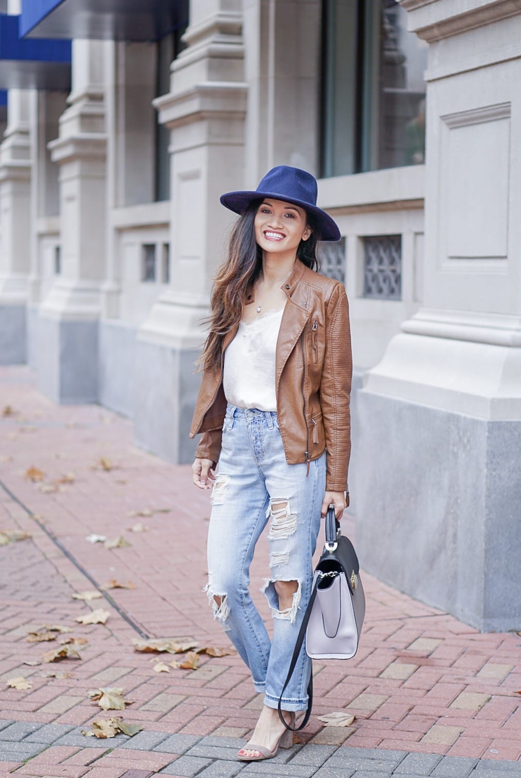 leather jacket, brown leather jacket, moto leather jacket, mom jeans, distressed jeans, navy felt hat, Steve Madden Carson sandal, white lace cami, Zac Zac Posen bag, spring outfit 