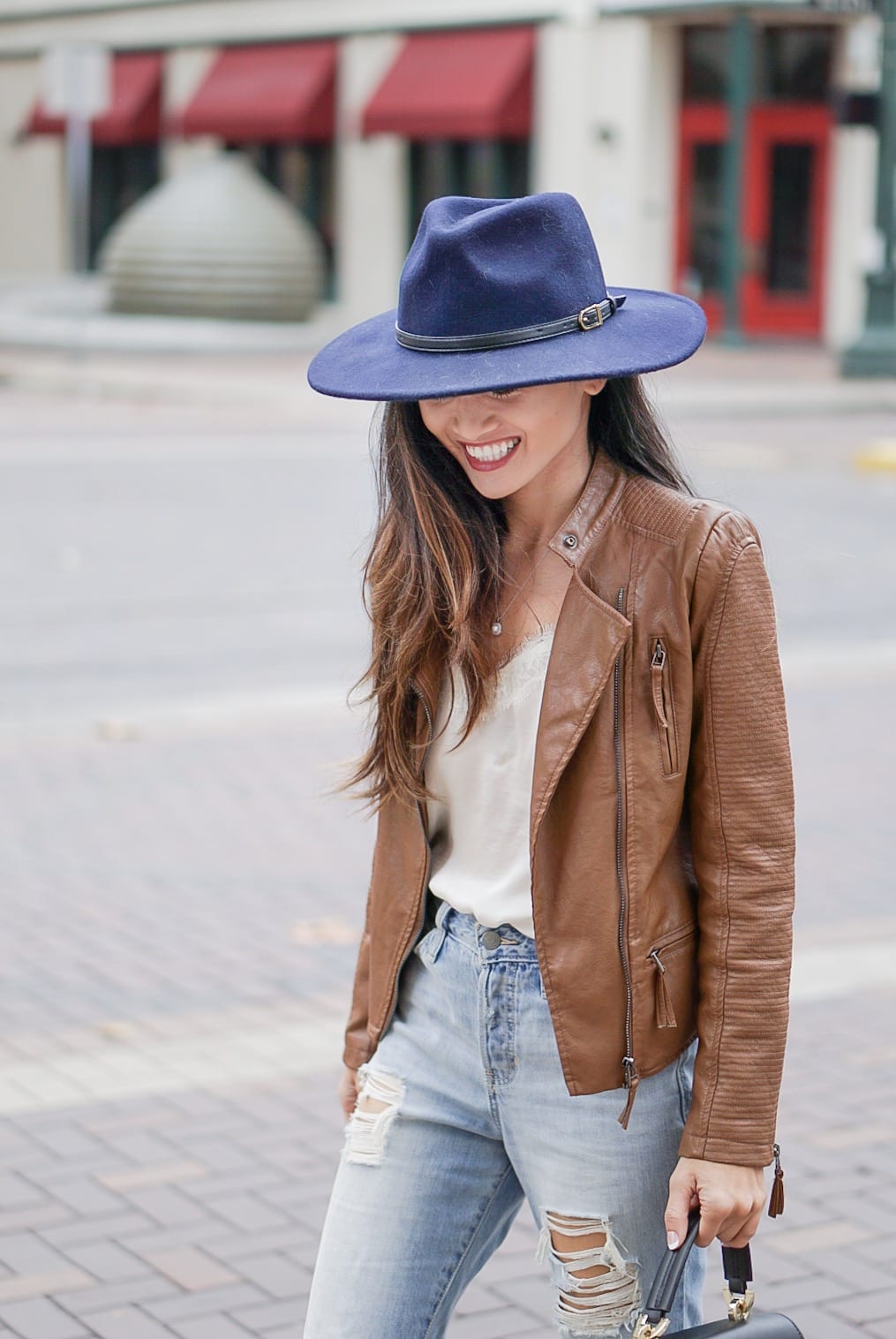 leather jacket, brown leather jacket, moto leather jacket, mom jeans, distressed jeans, navy felt hat, Steve Madden Carson sandal, white lace cami, Zac Zac Posen bag, spring outfit 