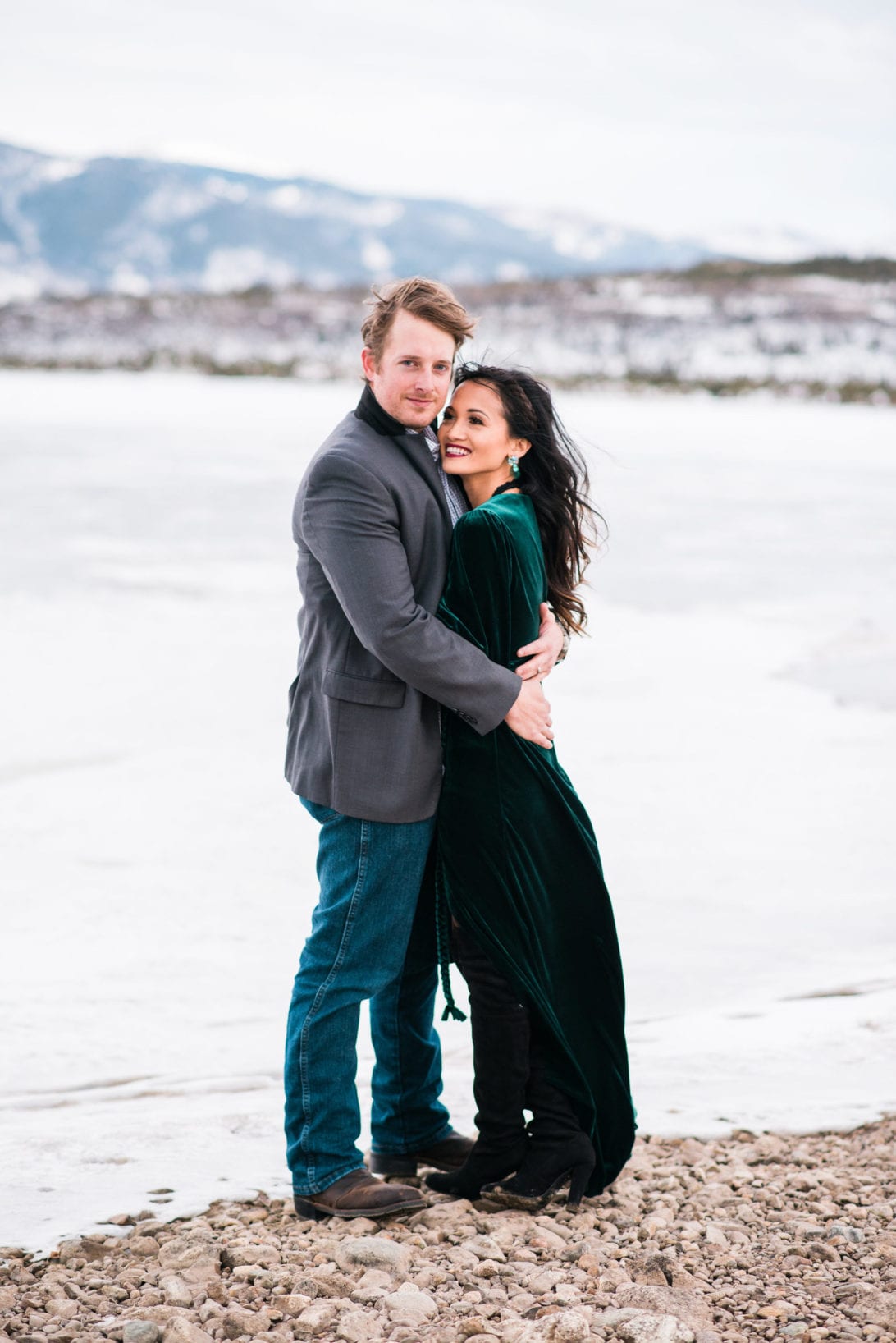 family pictures, snow family pictures, Colorado family pictures, frozen lake, christmas card family pictures, boy mom, green velvet dress, velvet dress, engagement pictures