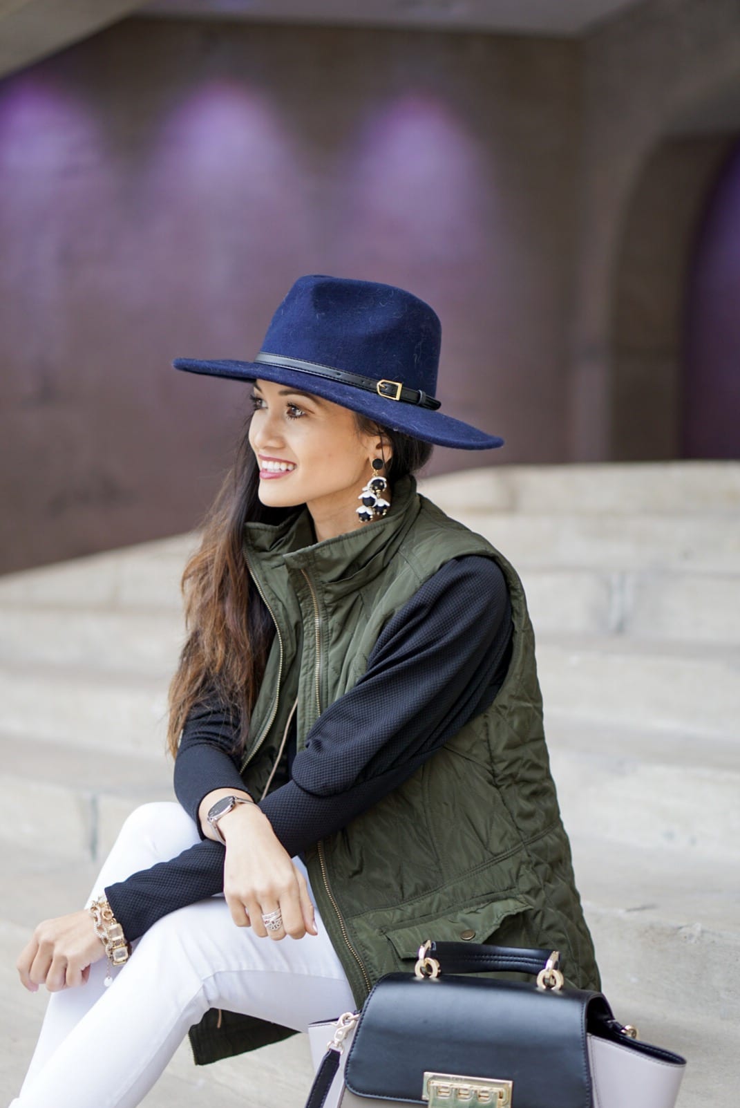 utility vest, green vest, Zac Posen bag, white jeans, white denim outfit, lace up heels, navy felt brim hat, red dress boutique, puff sleeves, bauble bar earrings, statement earrings, how to wear a vest, winter outfit, how to style a hat 