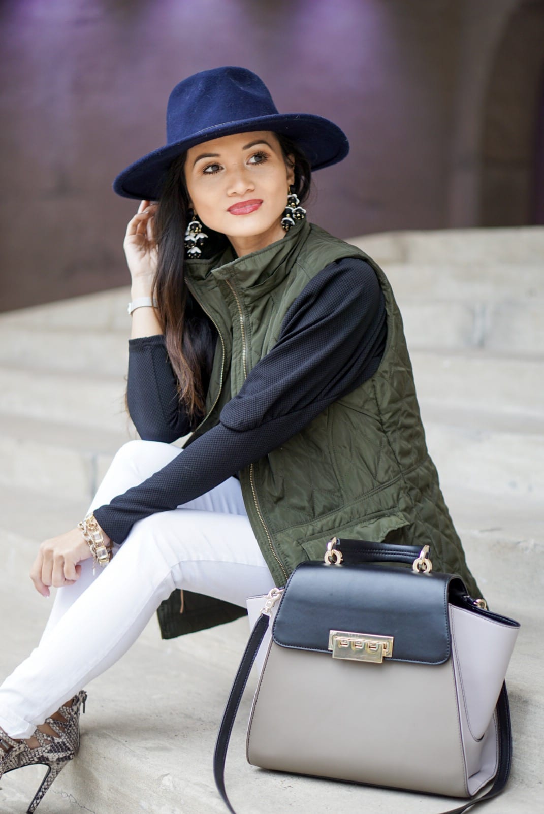 utility vest, green vest, Zac Posen bag, white jeans, white denim outfit, lace up heels, navy felt brim hat, red dress boutique, puff sleeves, bauble bar earrings, statement earrings, how to wear a vest, winter outfit, how to style a hat 