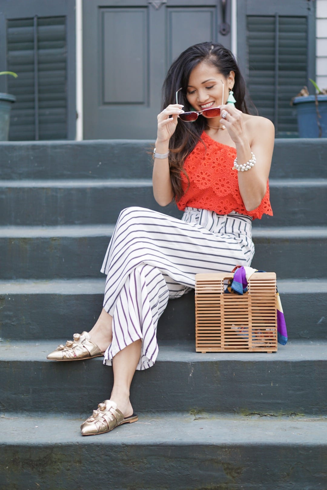 Jack by BB Dakota Lolita Top, striped pants, wide leg culottes, bamboo bag, quay sunglasses, one shoulder top, eyelet top, spring style, spring outfit, spring fashion, Rebecca Minkoff slides, Rebecca Minkoff Aden Slides, accessories for spring, tassel earrings 