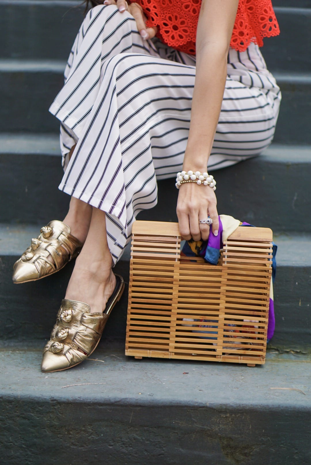 Jack by BB Dakota Lolita Top, striped pants, wide leg culottes, bamboo bag, quay sunglasses, one shoulder top, eyelet top, spring style, spring outfit, spring fashion, Rebecca Minkoff slides, Rebecca Minkoff Aden Slides, accessories for spring, tassel earrings 