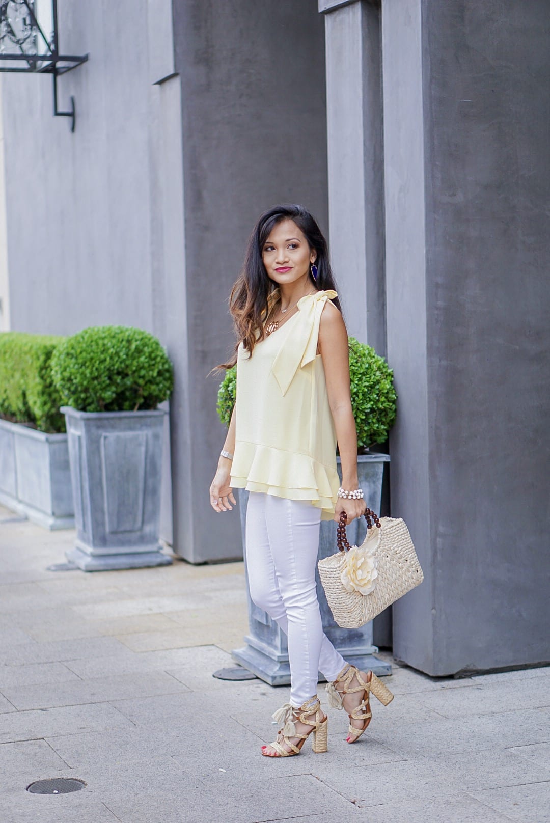 yellow tie sleeve top, peplum top, easter, easter outfit, spring style, spring fashion, straw bag, woven heels, wrap heels, pastel yellow, white jeans