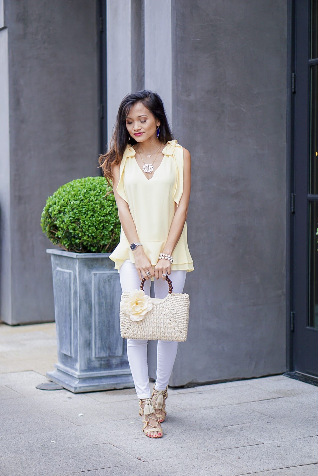 yellow tie shoulder blouse, yellow tie sleeve top, peplum top, easter, easter outfit, spring style, spring fashion, straw bag, woven heels, wrap heels, pastel yellow, white jeans