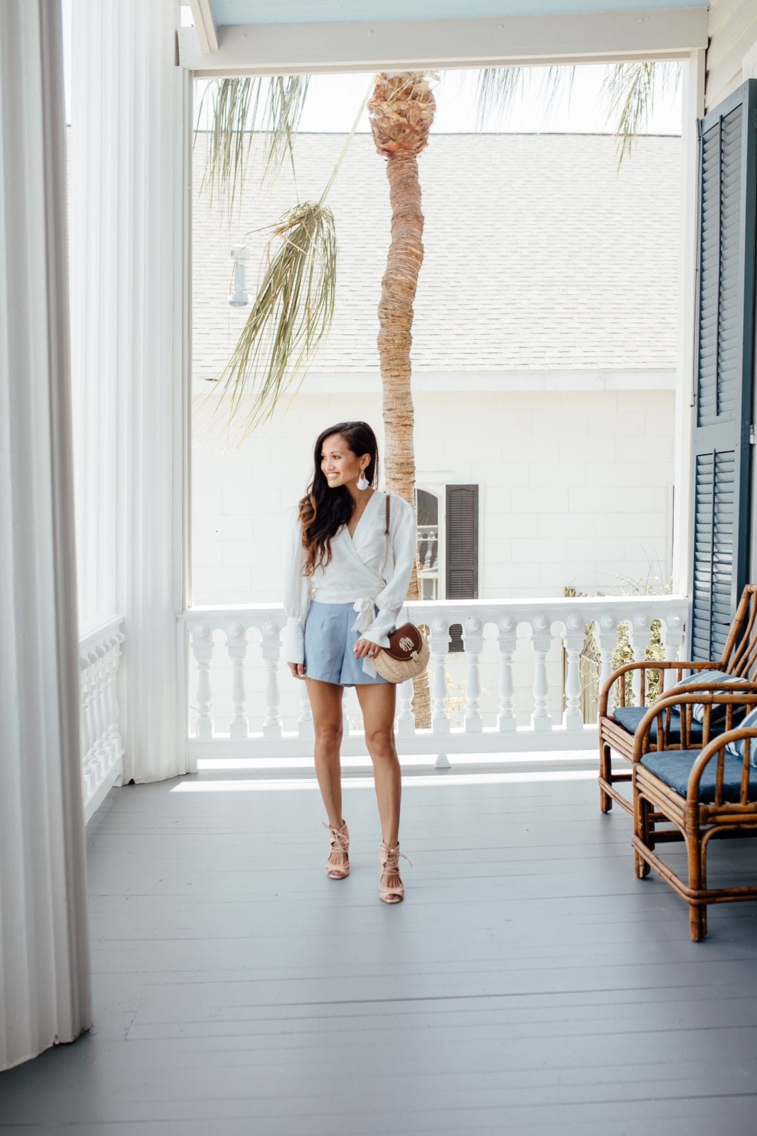 wrap blouse, GRLFRND denim,  REVOLVE, SUMMER STYLE, CROPPED JEANS, CARR MANSION, GALVESTON, SUMMER STYLE, SUMMER OUTFIT, MONOGRAMMED BAG, WICKER BAG, LISI LERCH EARRINGS, CHICWISH