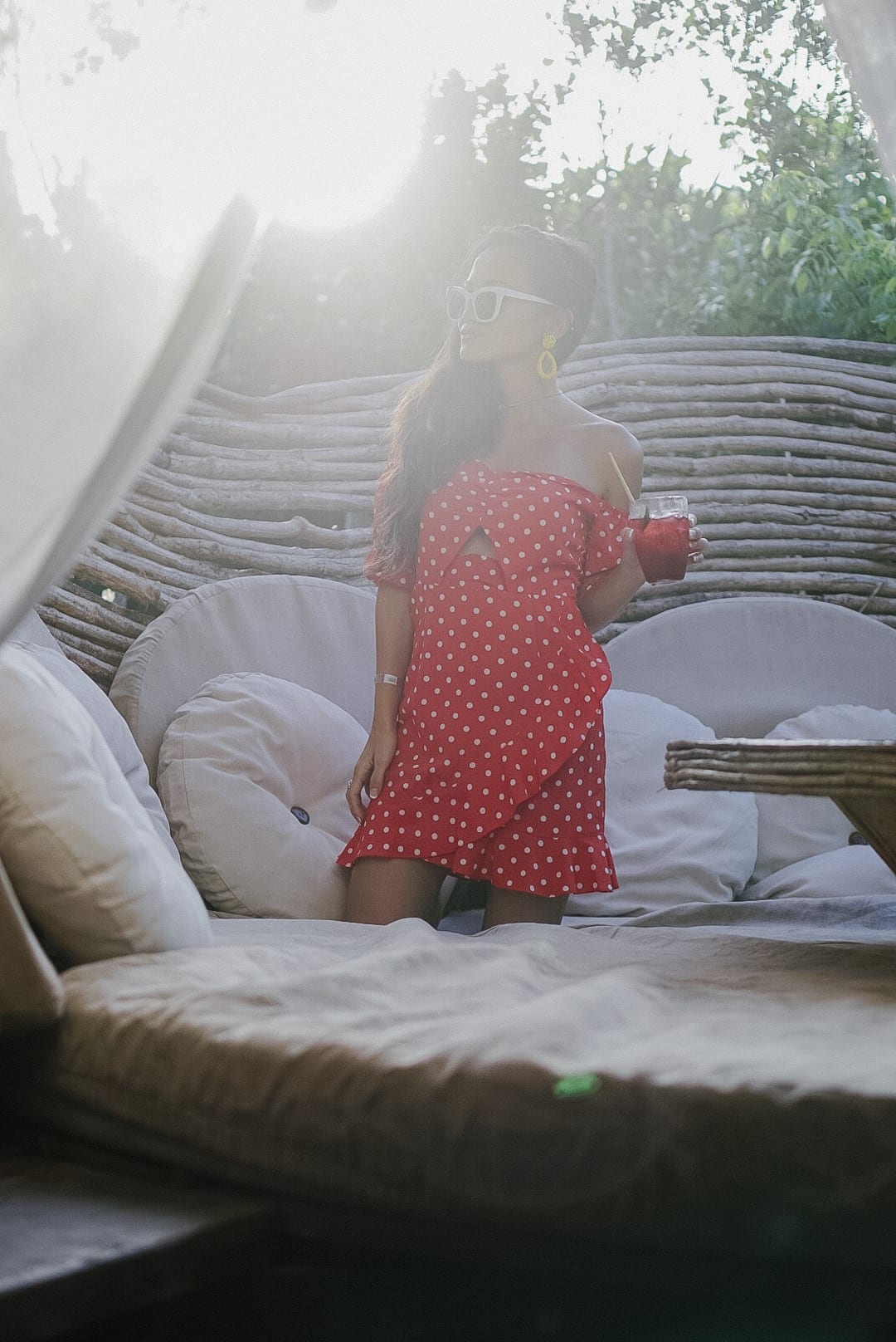 Kin Toh, Azulik, Tulum, Mexico, #travelstyle, #travelblogger, #vacationstyle, #dawnpdarnell, #houstonblogger, red polka dot dress, white cat eye sunglasses, Lisi Lerch earrings 