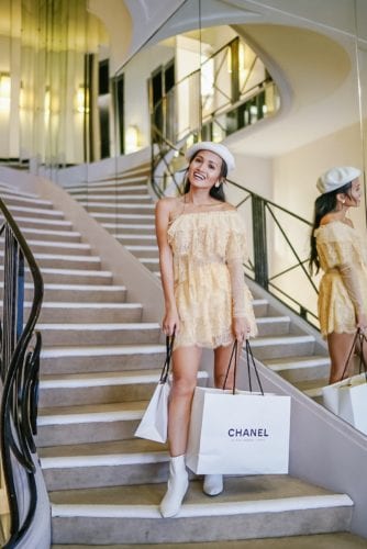 white Chanel shopping bag, Chanel grand staircase, Paris, Parisian style, Parisian outfit