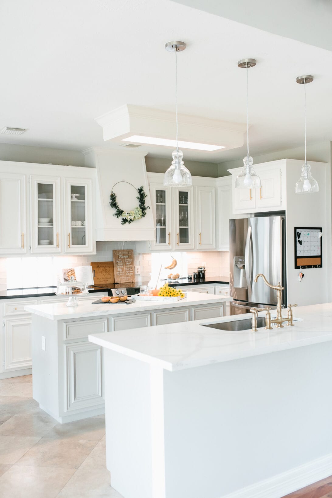 kitchen decor, summer kitchen, spring kitchen, gold faucet, brass faucet, glass cabinet doors 