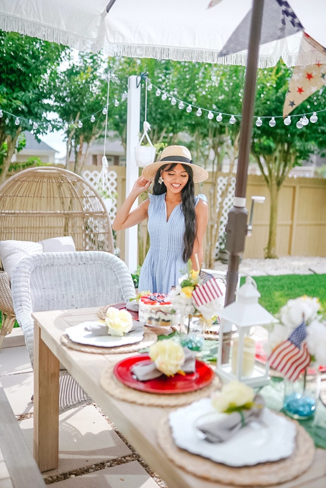 patriotic themed tablescape, patio decor, American flags, red and white chargers