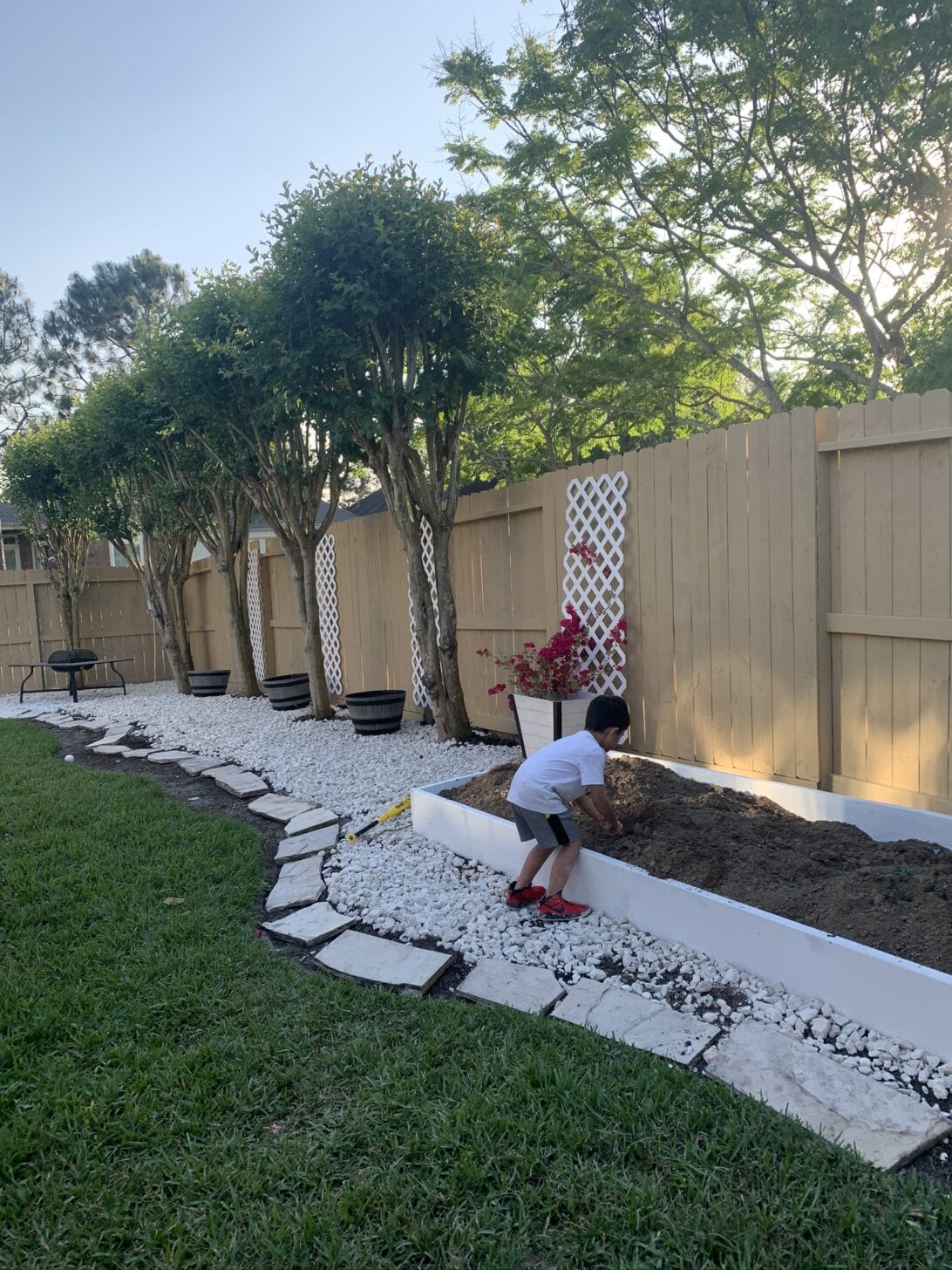 GRAVEL BACKYARD FLOWER BEDS