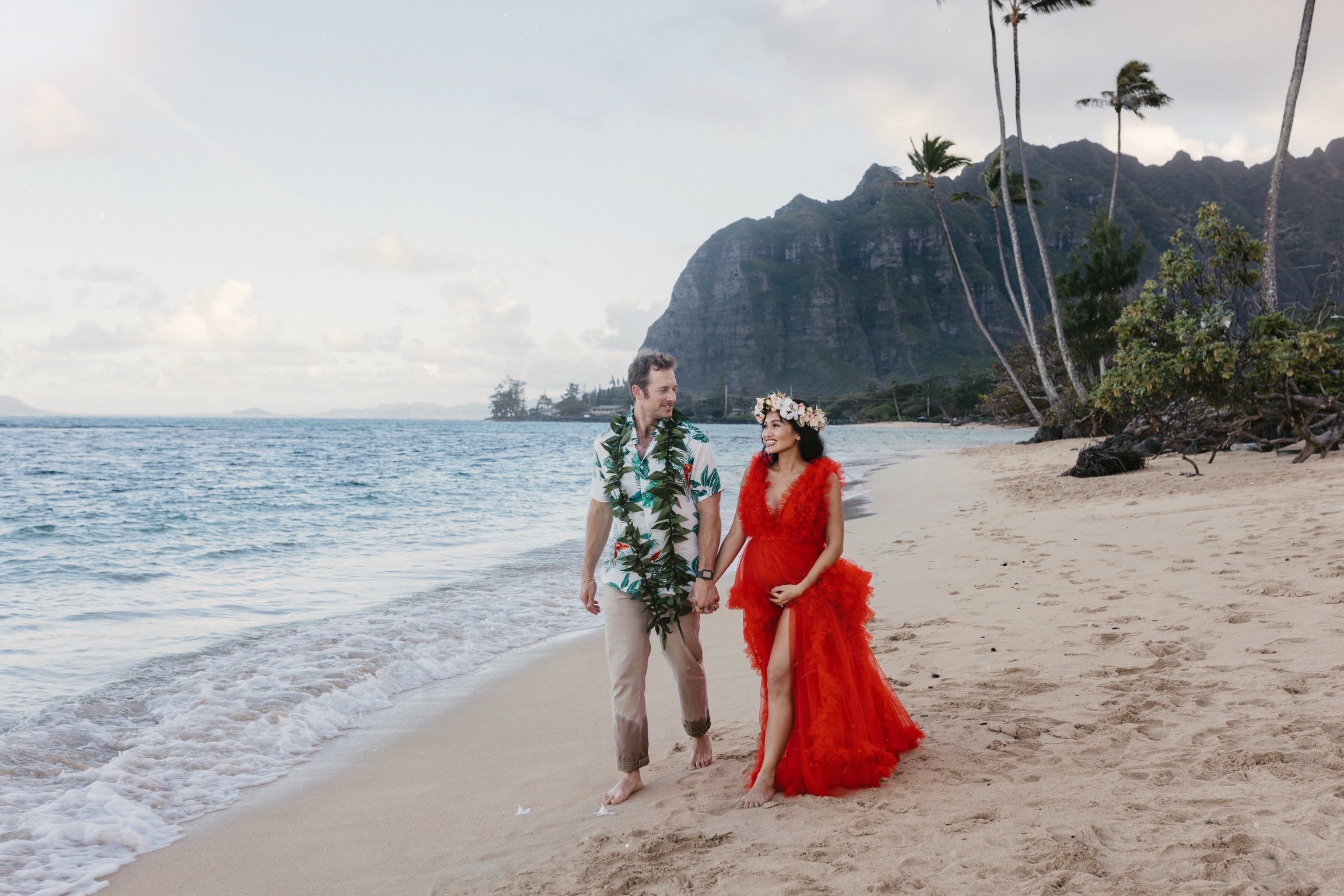 haku lei, red dress, maternity shoots, maternity dress, couples shoots, Hawaii, engagement photoshoot 