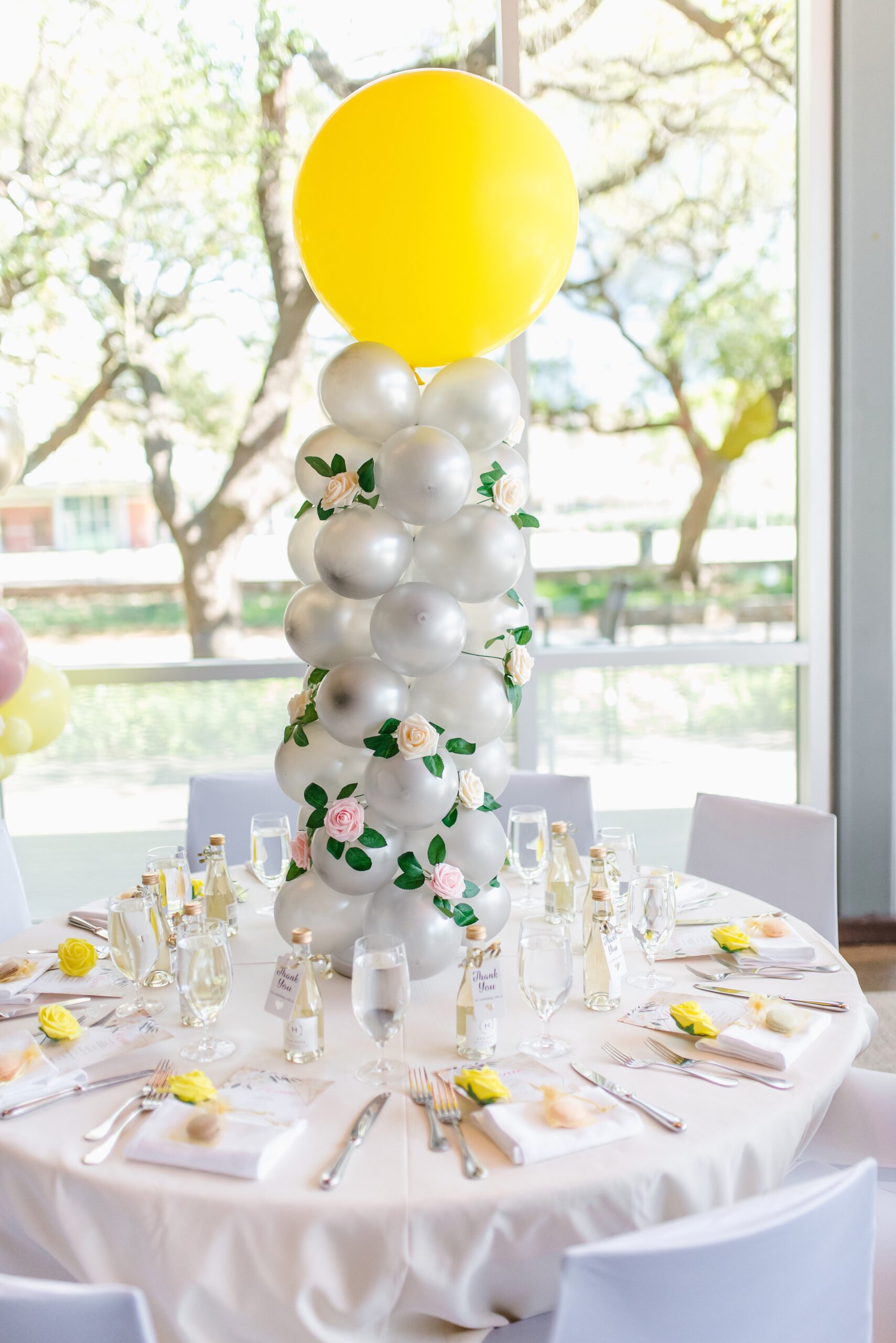 balloon center piece, balloon tower, place settting, yellow baby shower, floral baby shower, baby girl shower, baby in bloom, baby shower
