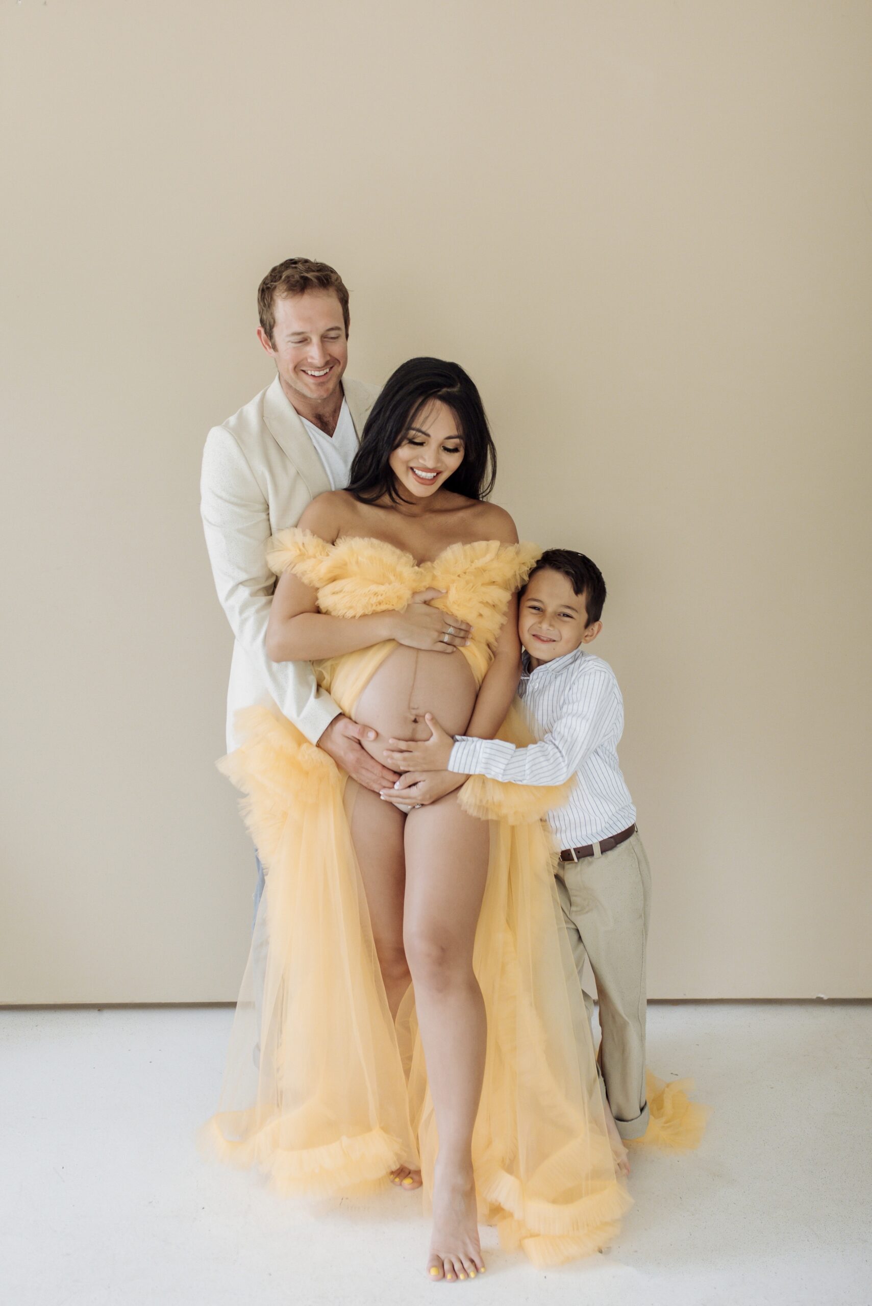 family maternity shoot, yellow tulle dress, maternity photoshoot 