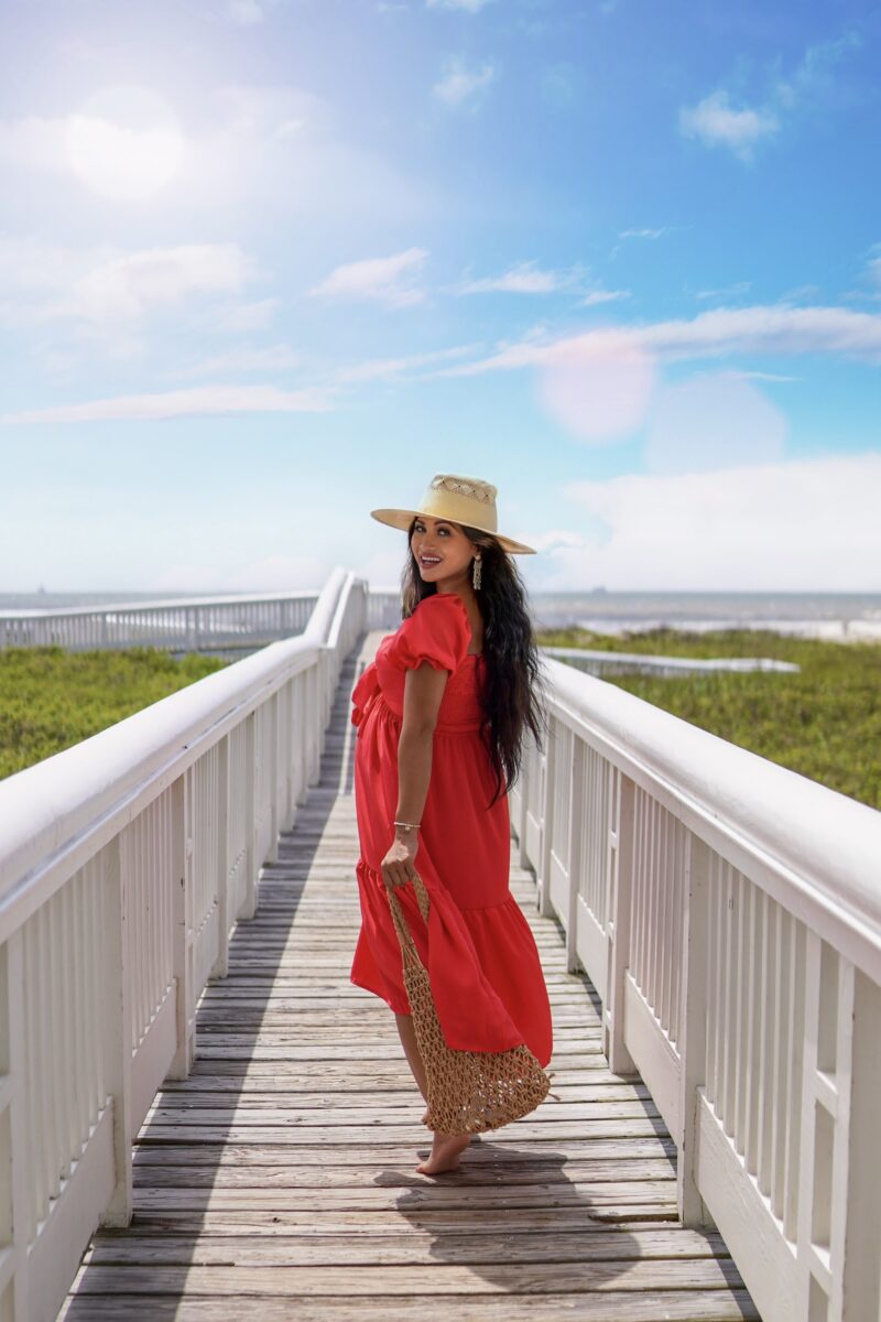red dress, Memorial Day outfit, straw hat, woven bag, pregnancy style, summer pregnancy outfit, bump style, mom earrings 
