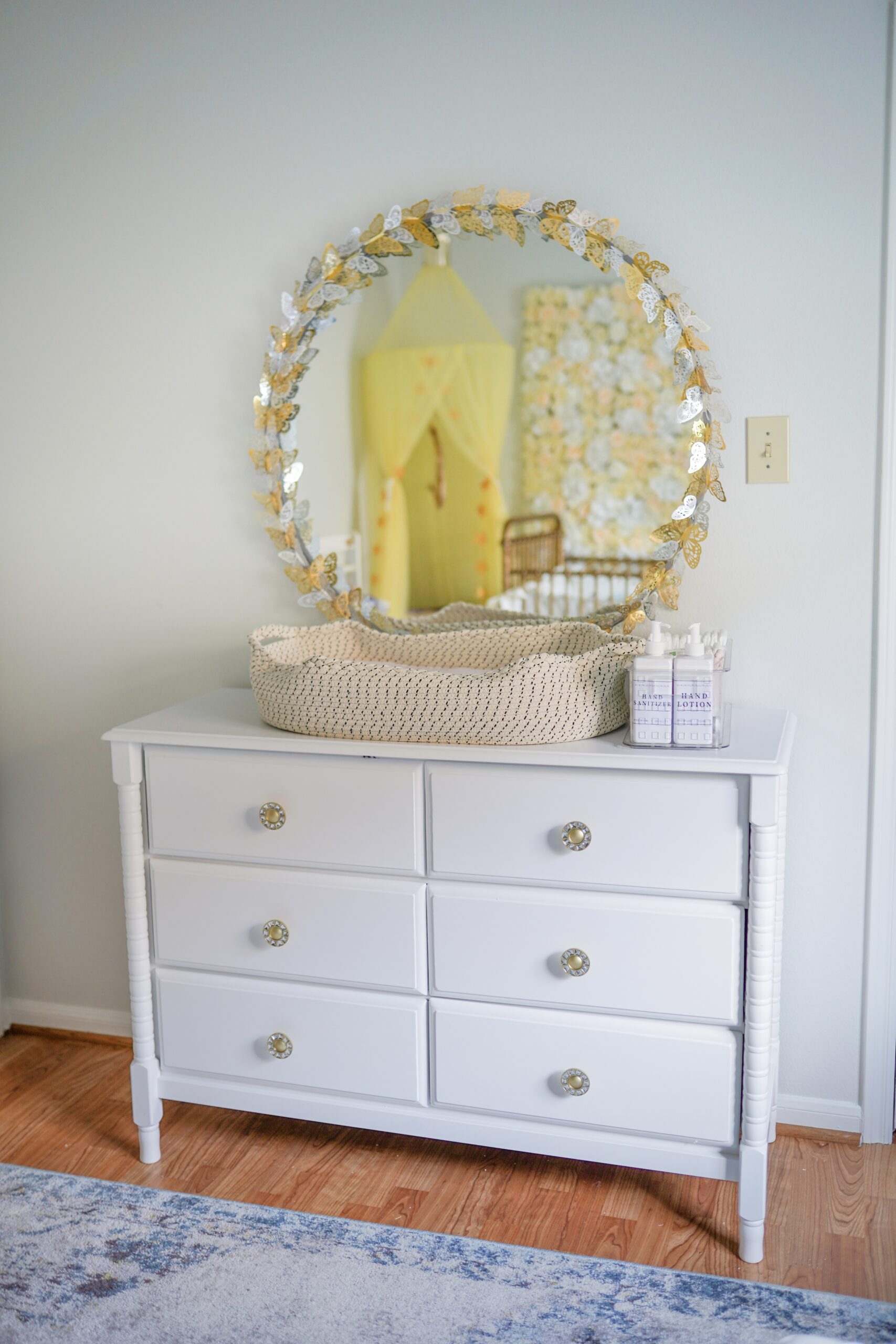 nursery, changing table, round gold mirror, butterfly mirror, DaVinci Jenny Lind Dresser