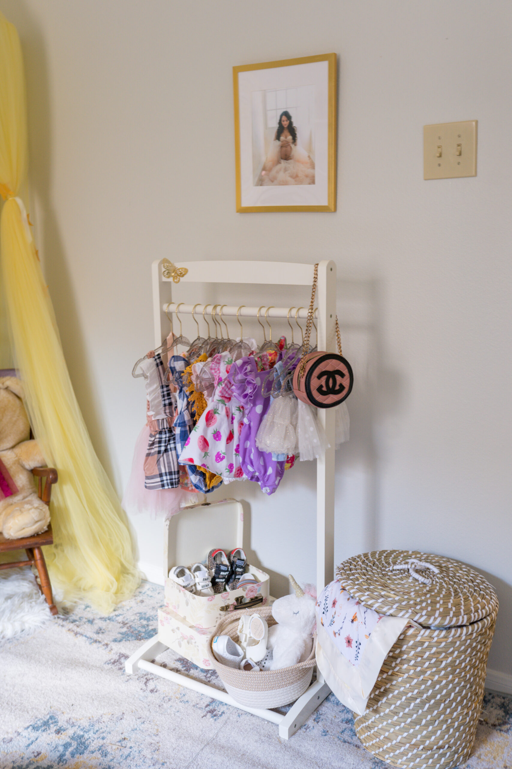 baby girl nursery, outfit rack